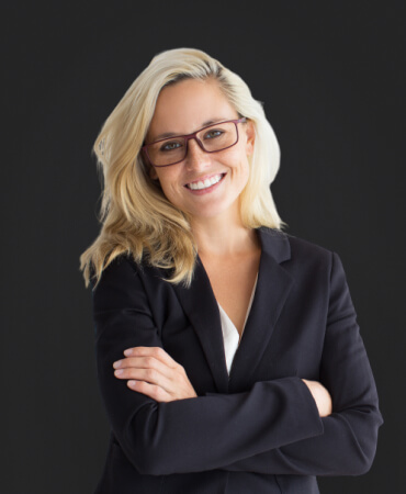 young woman with blonde hair in black suit