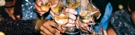 hands with full glasses - cheers