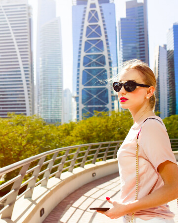 woman in front of Dubai skyscrapers